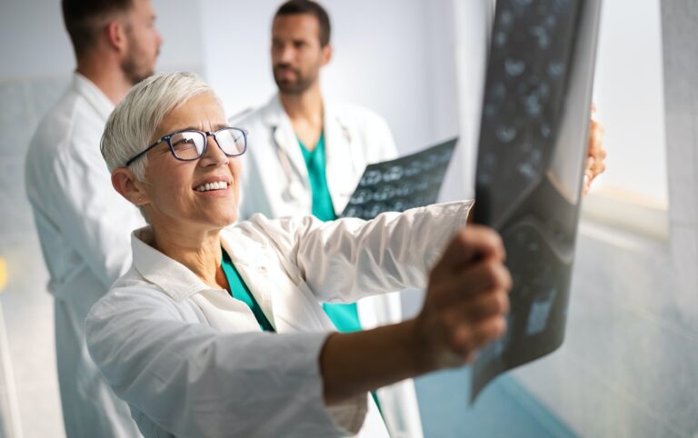 Group of doctors checking x-rays in a hospital