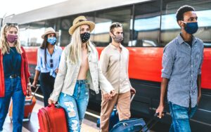 People traveling with face mask on new normal covid restrictions